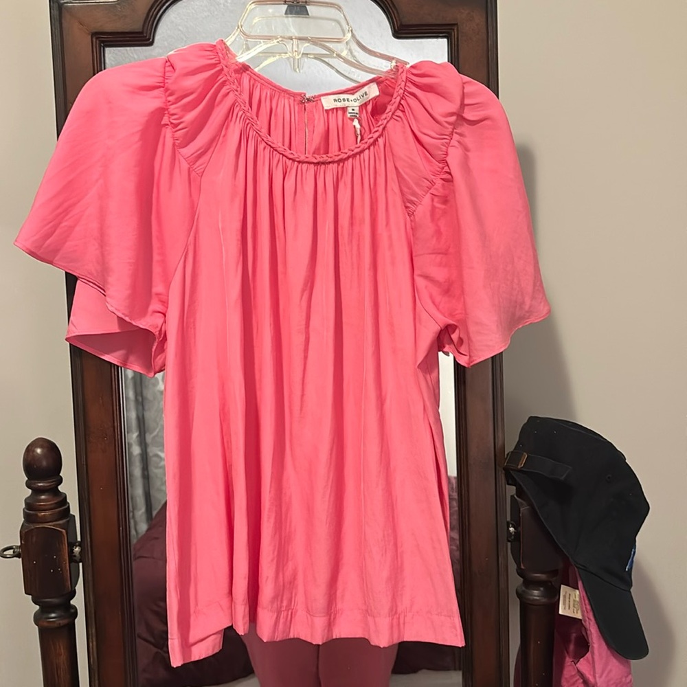 Pink flowy top. Perfect for work or with some jeans.